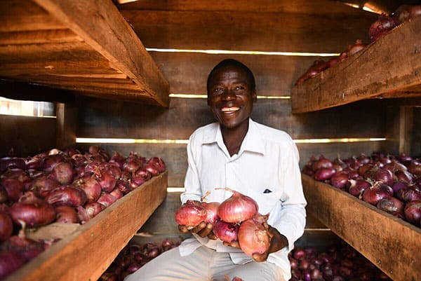 man holding onions